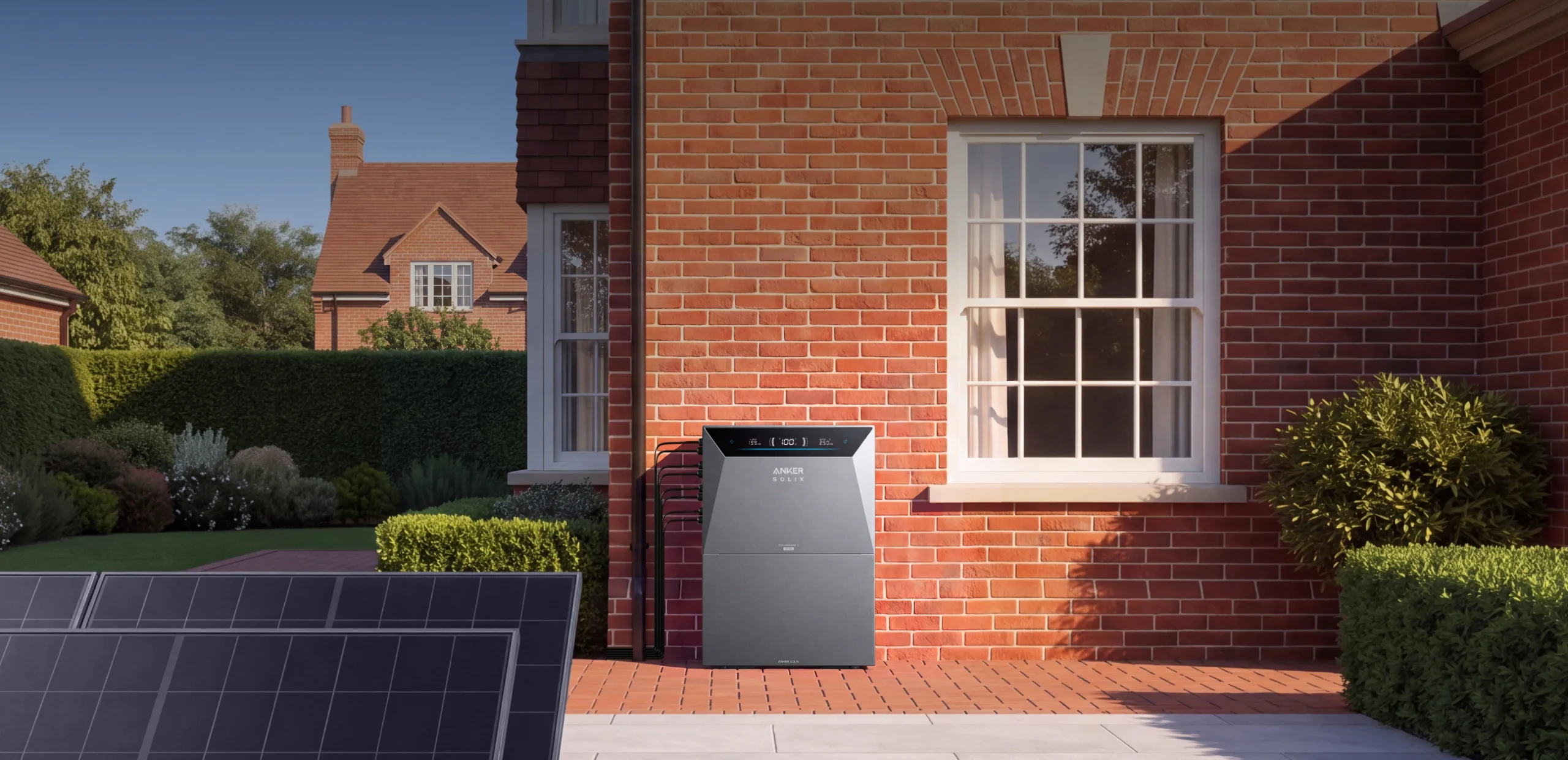 Anker SOLIX Solarbank 4 Pro installed outdoors on a patio, solar panels in foreground